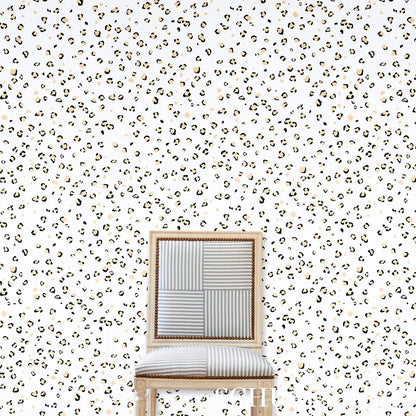 Leopard print wallpaper backdrop with a light wood-framed chair featuring a patchwork striped backrest and cushioned seat.