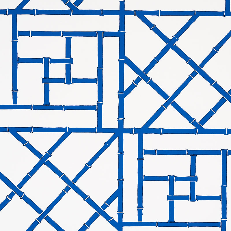 Indigo trellis wallpaper with an interlocking lattice pattern on a white background.