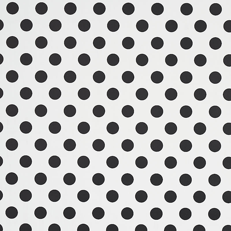 White background with evenly spaced black polka dots in a grid-like pattern.