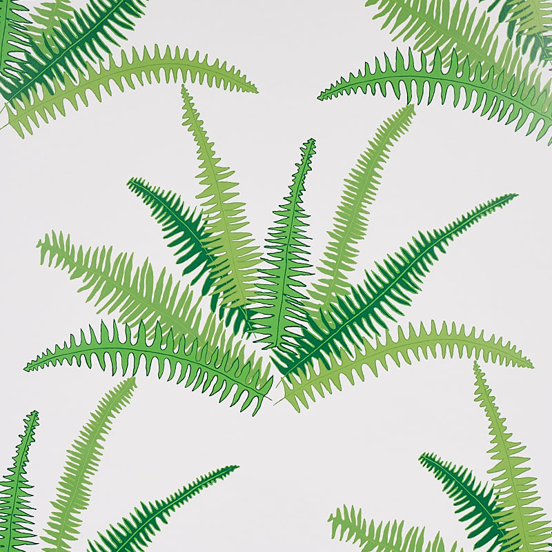 Green fern leaf pattern with lime to emerald fronds on light background, ideal for wallpaper or fabric.