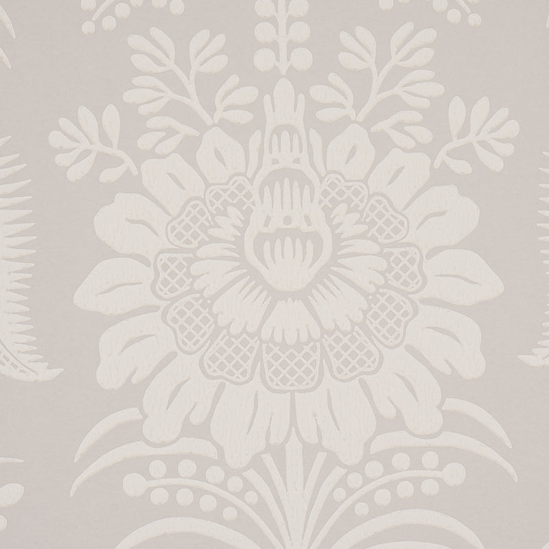 Beige wallpaper with a large white damask floral pattern and leafy detailing.
