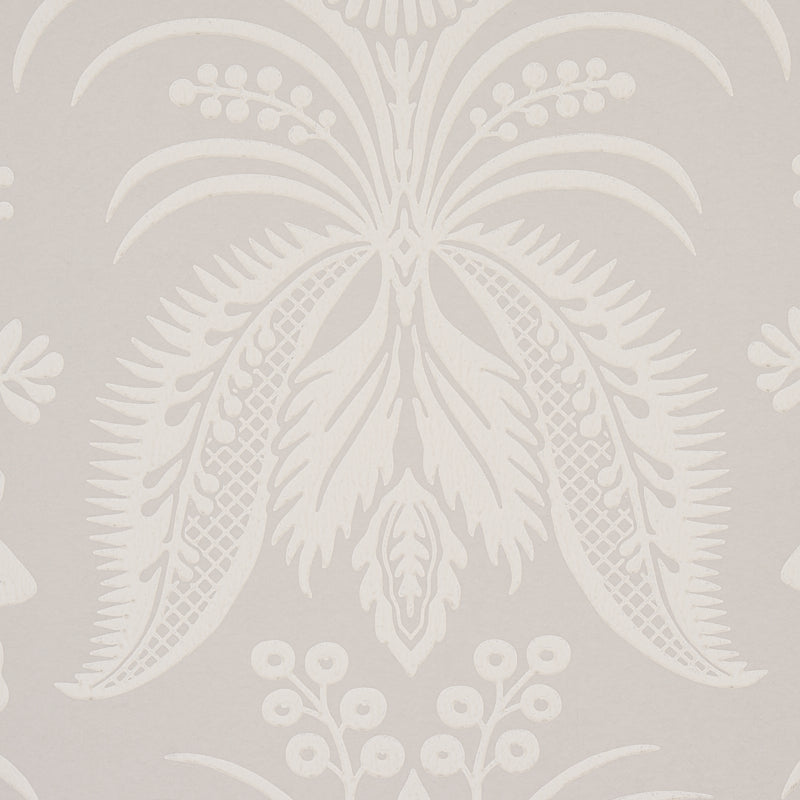 Cream damask palm-leaf wallpaper on beige background; decorative tropical wallcovering.