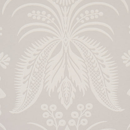 Cream damask palm-leaf wallpaper on beige background; decorative tropical wallcovering.