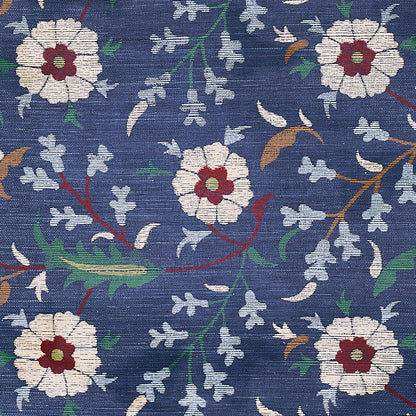 Blue sisal with a floral pattern of white flowers with red centers, green leaves and twisting vines.