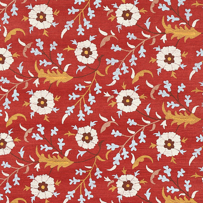 Red floral sisal wallcovering with white daisy-like blooms, pale blue accents and gold vines.