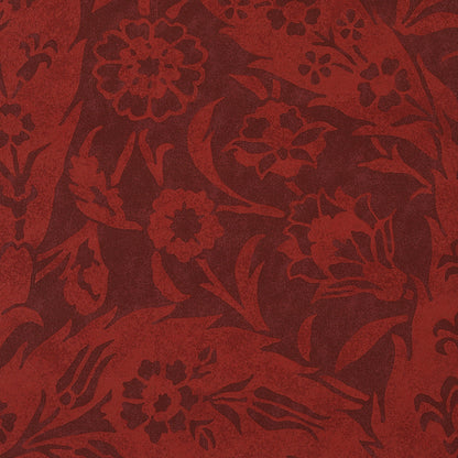 Red damask floral textile with ornate blossoms and swirling leaves.