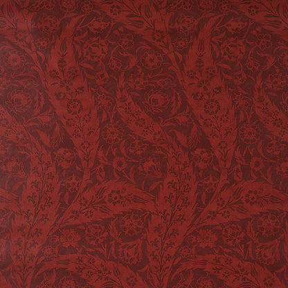 Deep burgundy paisley fabric with an ornate pattern, suitable for upholstery.