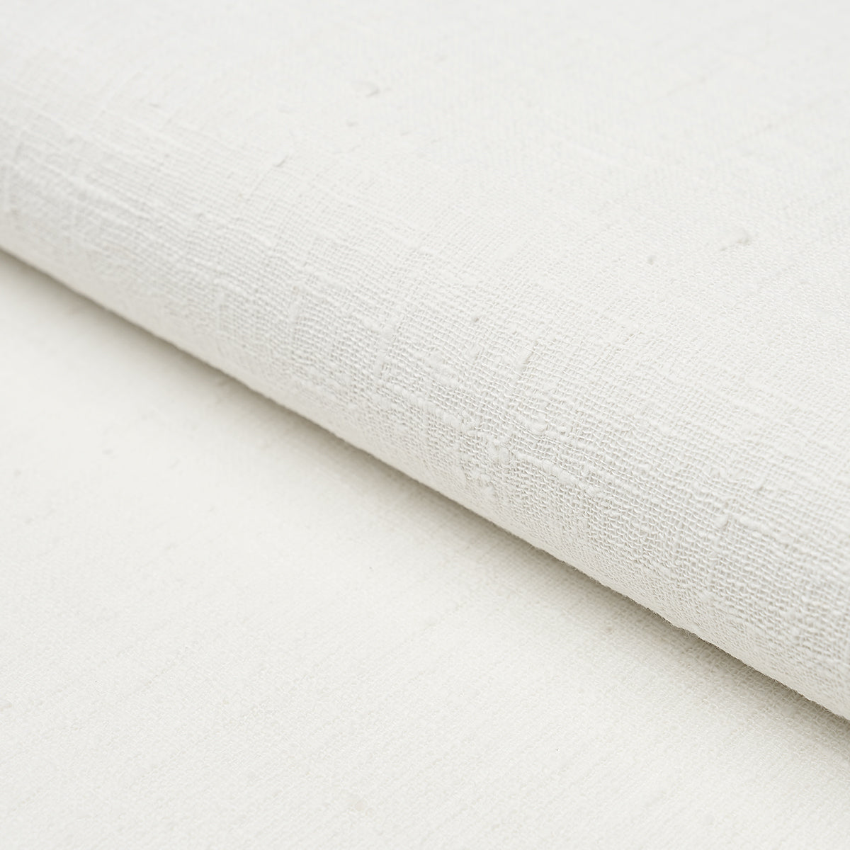 Close-up of white linen bark grasscloth wallcovering with a woven texture; natural-looking wallcovering for walls.