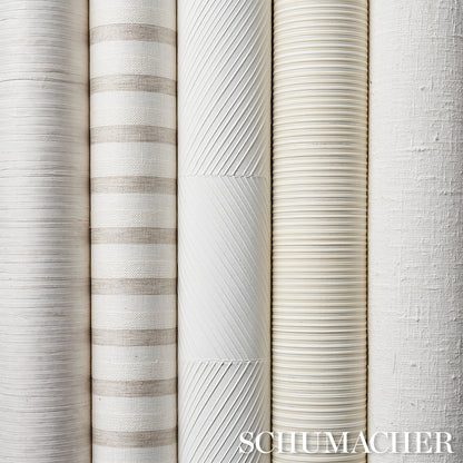 Row of neutral wallpaper rolls with striped and textured patterns in white, beige, ivory, and light gray.