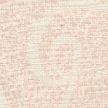 Cream grasscloth wallpaper with a pale pink paisley motif and natural textured weave.