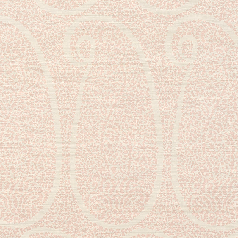 Blush grasscloth wallpaper with a paisley pattern and textured sisal weave.