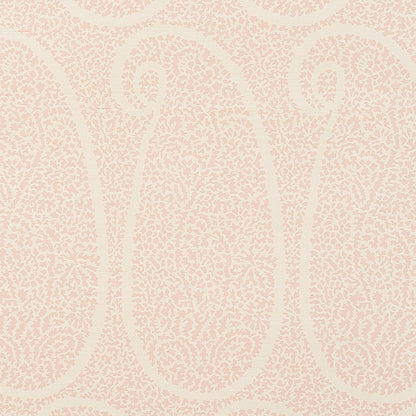 Blush grasscloth wallpaper with a paisley pattern and textured sisal weave.