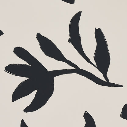 Beige background with bold black brushstroke botanical leaves in abstract style.