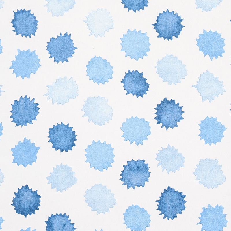 Pattern of blue watercolor sunburst shapes in light to navy blues; decorative fabric or wallpaper print.