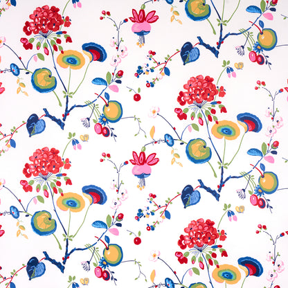 Colorful floral textile print with red clustered blossoms, blue stems, and yellow-green round accents against white backdrop.