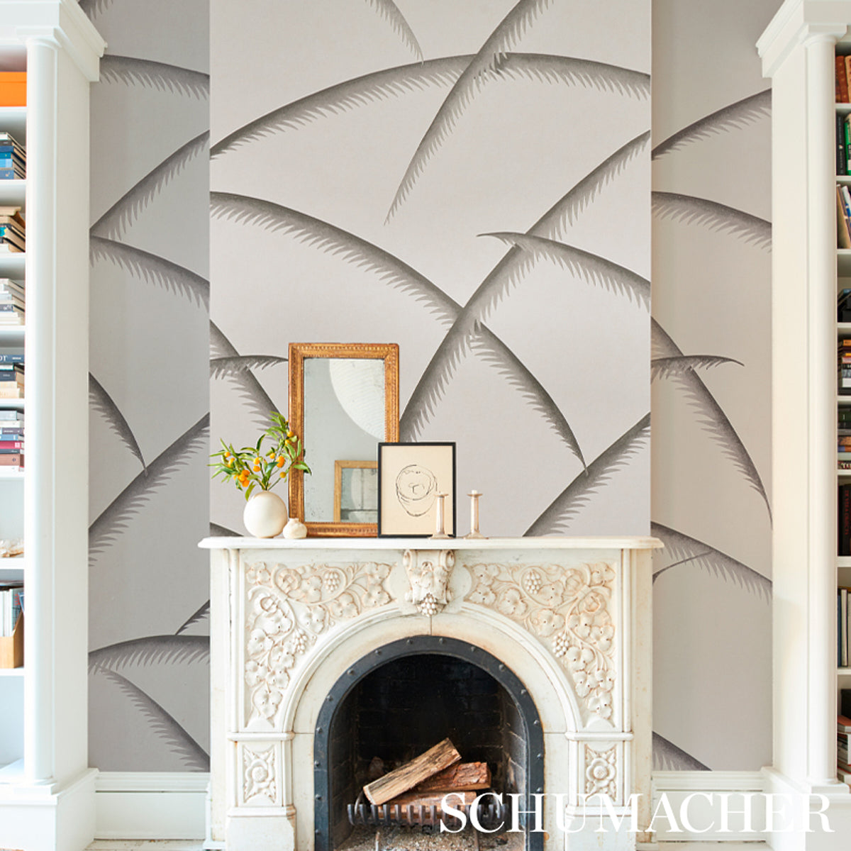 Charcoal Deco palm wallpaper with repeating palm-leaf motifs on a wall.