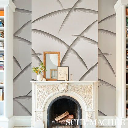 Charcoal Deco palm wallpaper with repeating palm-leaf motifs on a wall.