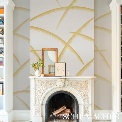 Gold palm-deco wallpaper with palm motifs; includes gold frame, small mirror, vase & candles.