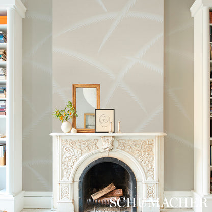 Wallpaper in ivory on natural background featuring a palm-deco pattern of stylized palm fronds.