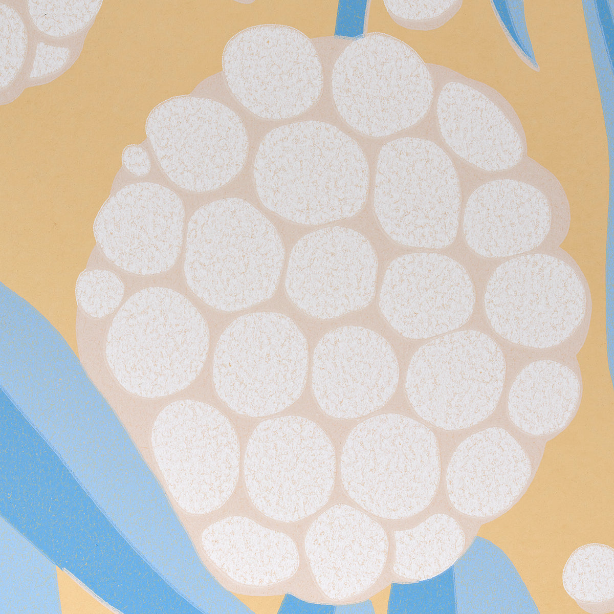 Abstract berry-cluster pattern with white circular shapes on warm yellow background and blue accents, textile print.