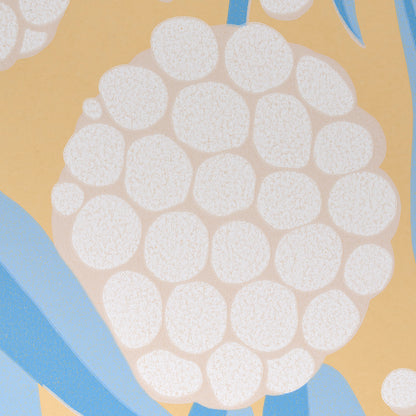 Abstract berry-cluster pattern with white circular shapes on warm yellow background and blue accents, textile print.