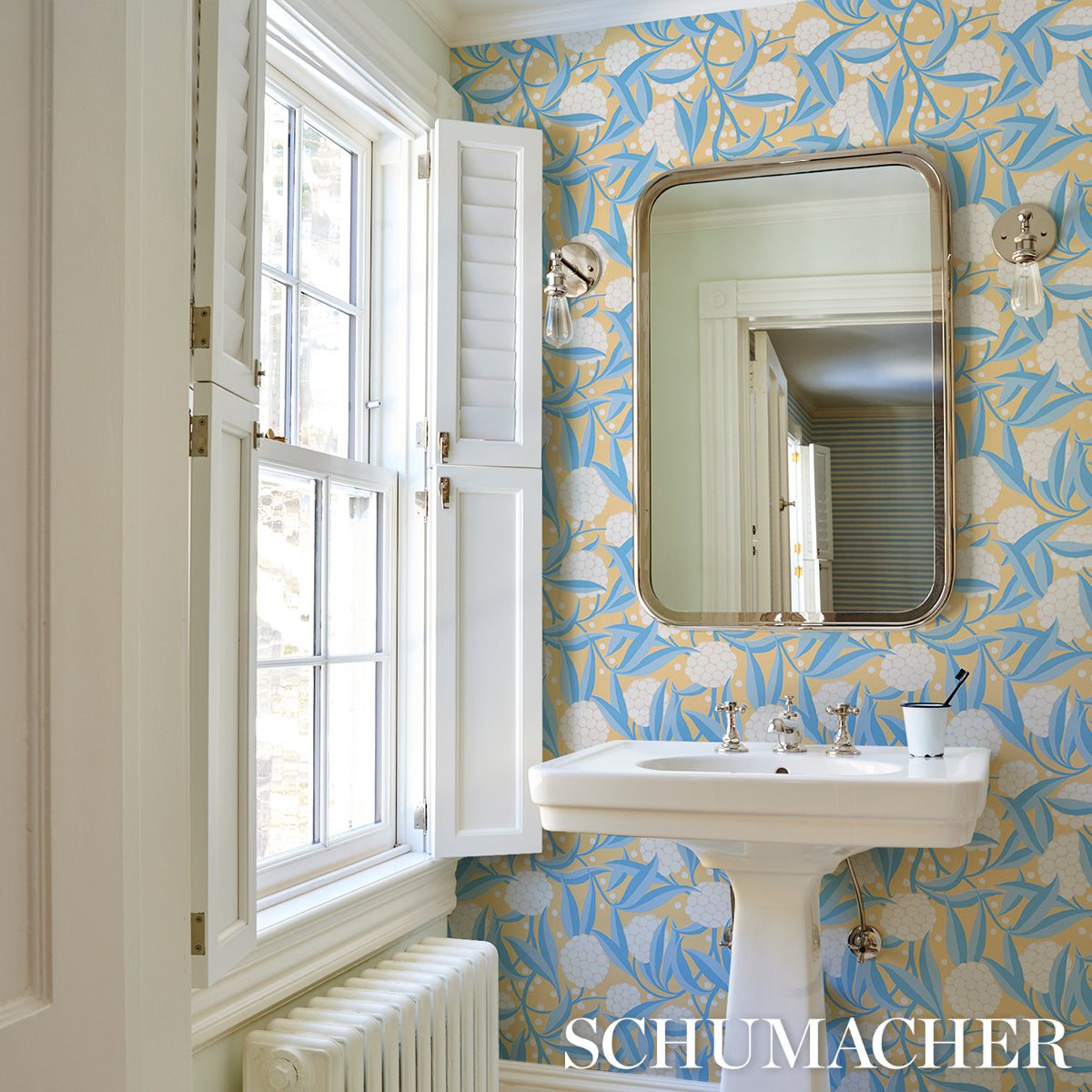 Bright yellow leaf-pattern wallpaper.