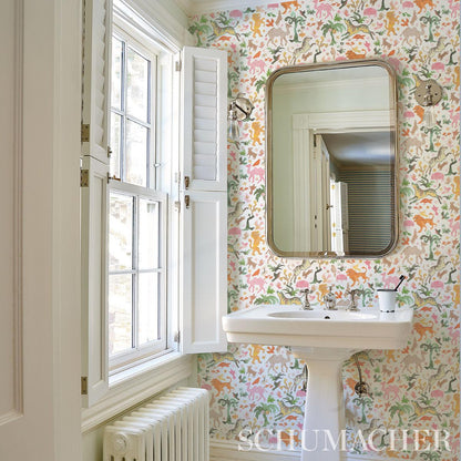Schumacher Beasts Wallpaper in Pink and Gold by Happy Menocal featuring hand-painted exotic animals and whimsical floral motifs in a playful luxury design. Ideal for accent walls, nurseries, bedrooms, powder rooms, and creative interiors with artistic, colorful, and maximalist wallpaper styling.