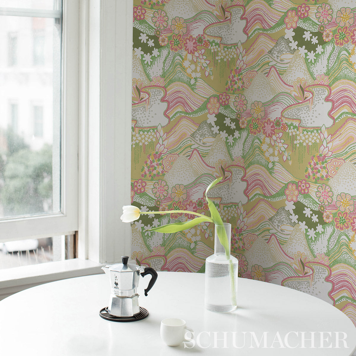 Pastel floral wallpaper with a green and pink daisy chain pattern.