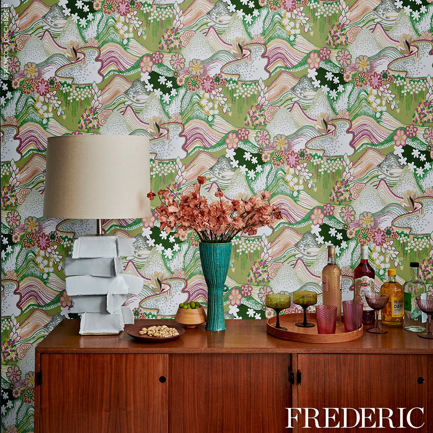 Daisy Chain floral pattern in green and pink on fabric.