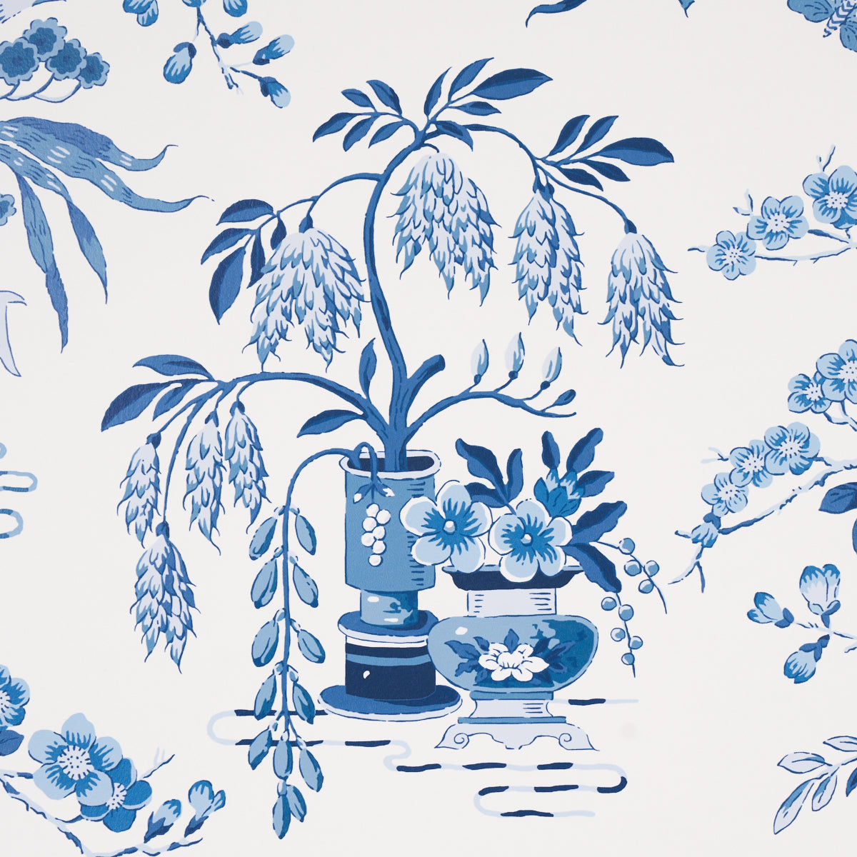 Blue and white porcelain floral pattern featuring a central vase, cascading wisteria and blooming branches.
