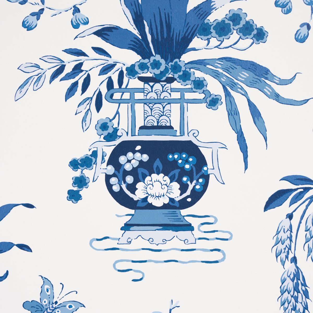 Blue and white porcelain Ming vase with a floral bouquet, ornate handles, surrounded by botanical leaves in a wallpaper pattern.
