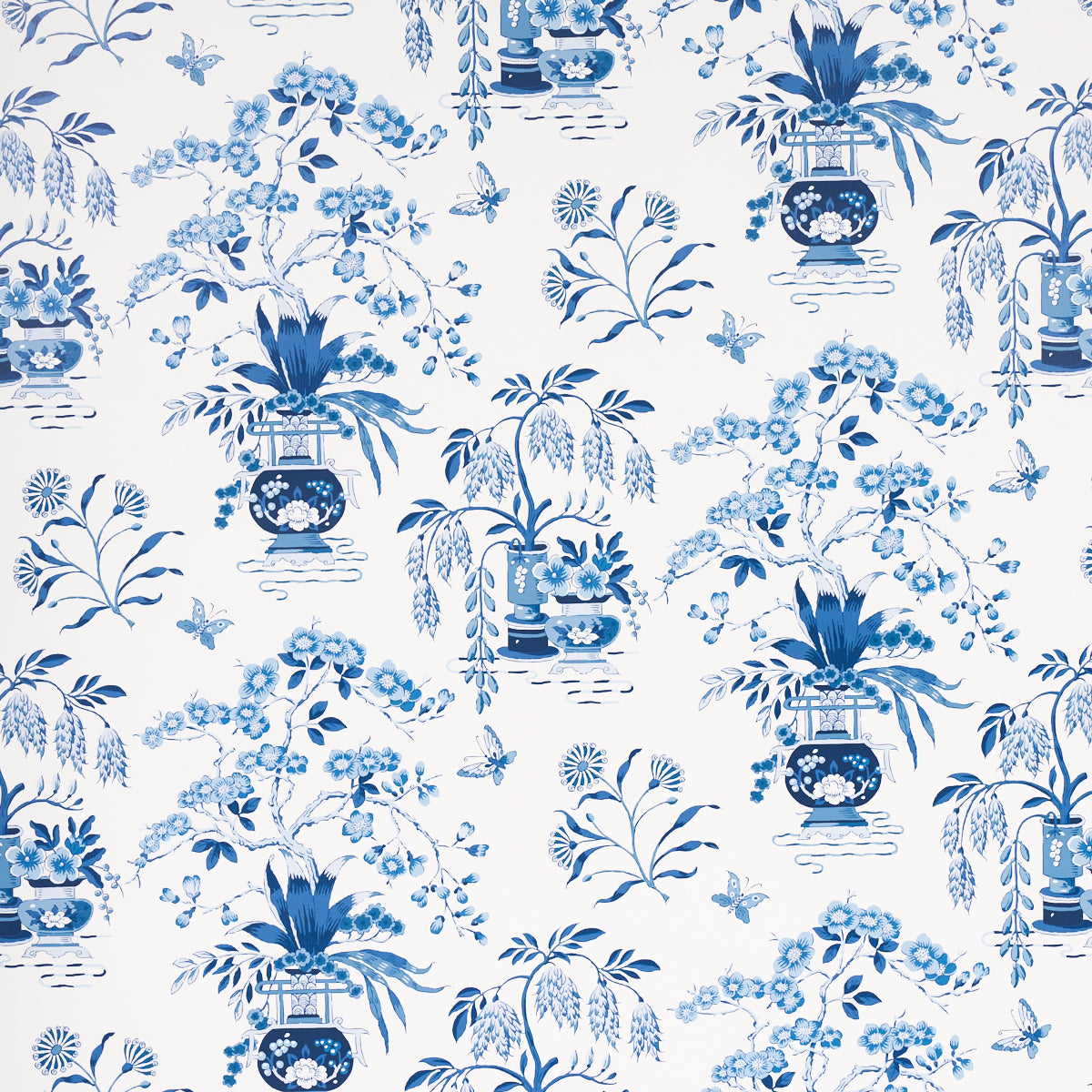 Blue and white chinoiserie floral pattern with vases and leafy branches; repeating decorative design.