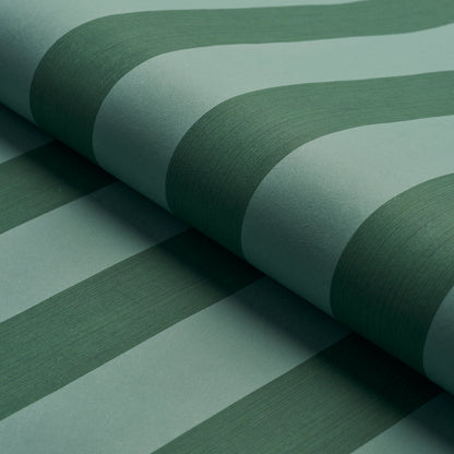 Close-up of green striped wallpaper in mint & emerald tones, rolled with curved edges.