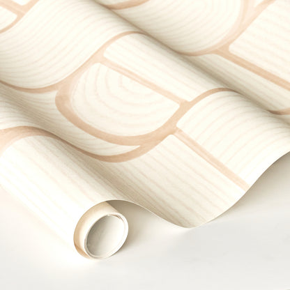 Cream wallpaper with pale peach brick pattern, rolled edge and soft folds