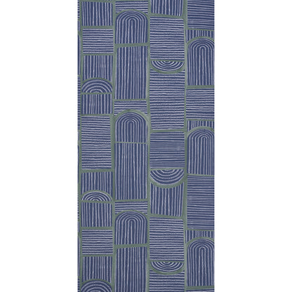Navy geometric rug with vertical striped blocks and arched motifs separated by olive-green grid lines.