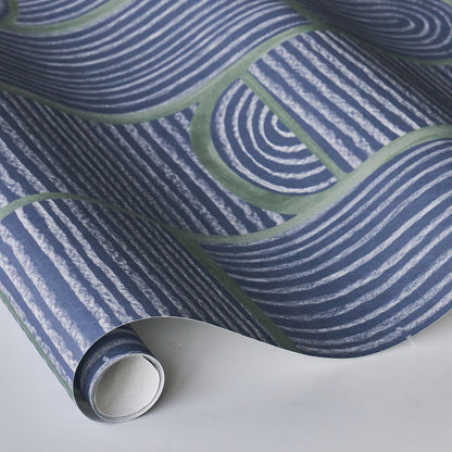 Rolled deep navy wallpaper with white wavy stripes and green curved bands