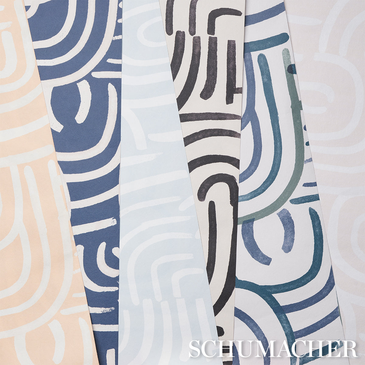 Assorted wallpaper samples with abstract curved-line prints in beige, navy, light blue, black, and teal.