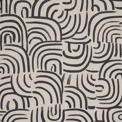 Carbon backdrop with dense black curved lines forming an abstract labyrinth pattern.