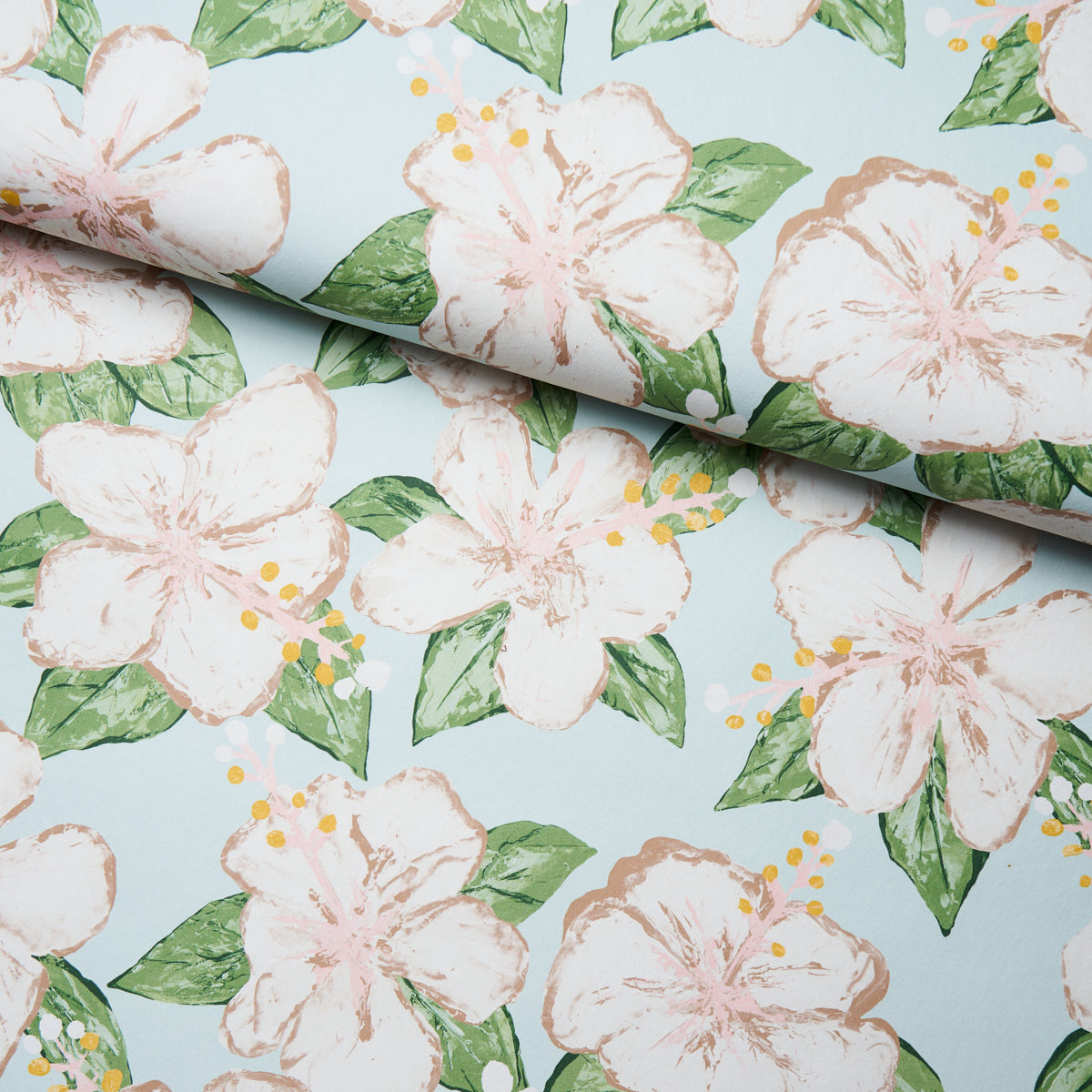 Soft blue floral pattern with pale pink hibiscus flowers and green leaves; rolled edge.