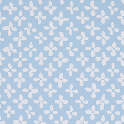 Light blue fabric with white four-petaled floral ditsy pattern, cheerful summer textile.