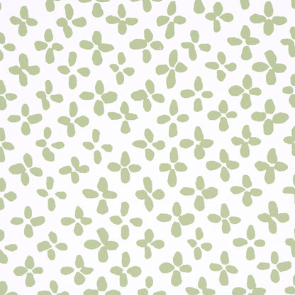 Soft green four-petaled floral motifs in a repeating pattern across an ivory background.