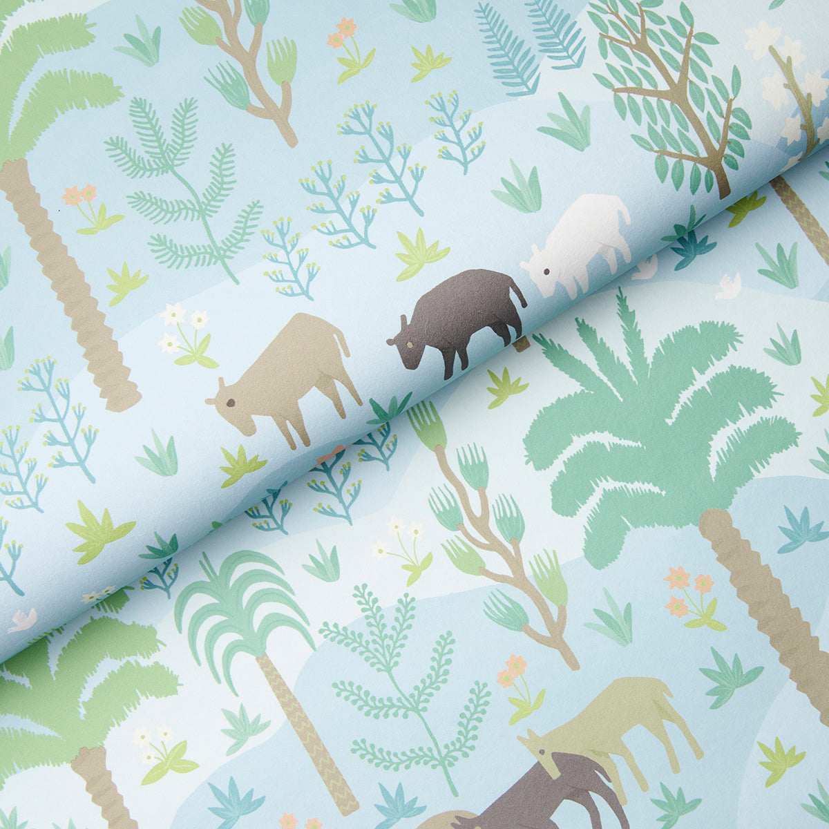 Light blue fabric with tropical jungle print: palm trees, ferns, and small beige to brown animal silhouettes.