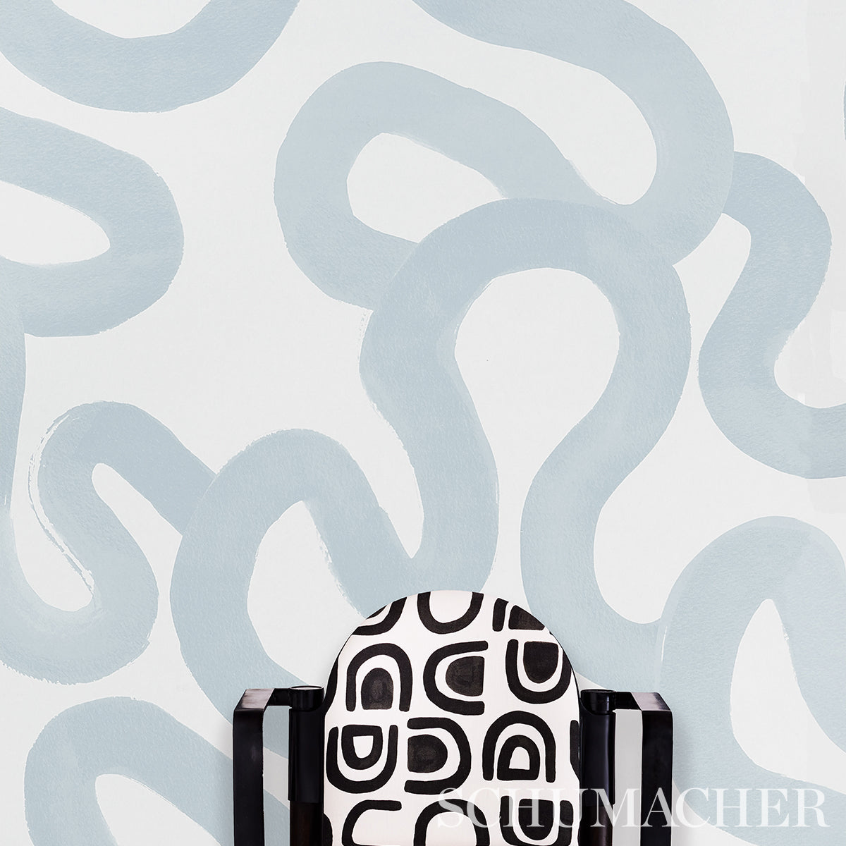 Sea-toned rug with a subtle linear geometric pattern.