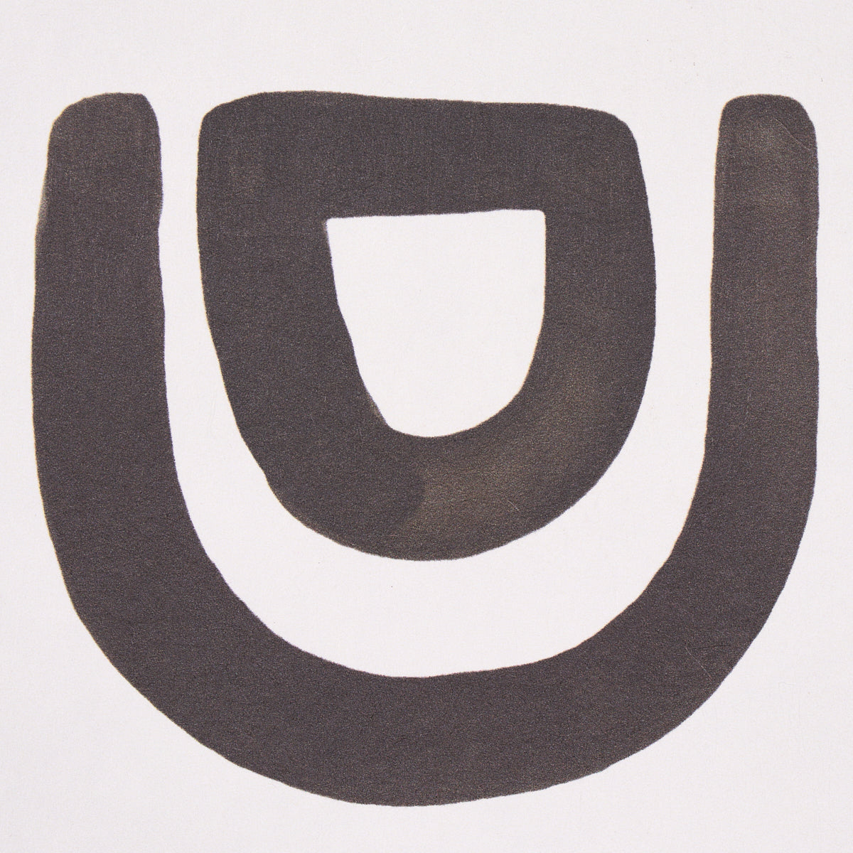 Carbon threshold featuring a bold black U-shaped graphic with an inner hollow U; minimalist logo-style emblem.