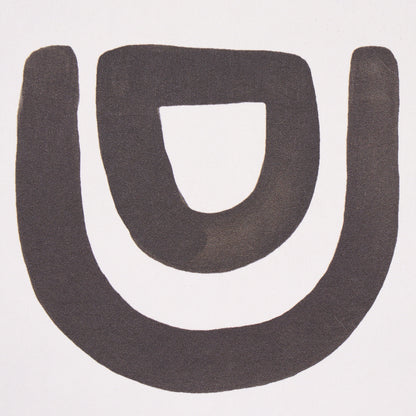 Carbon threshold featuring a bold black U-shaped graphic with an inner hollow U; minimalist logo-style emblem.