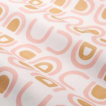 Soft white fabric with abstract pink and peach curved shapes and mustard yellow geometric accents, modern retro print.