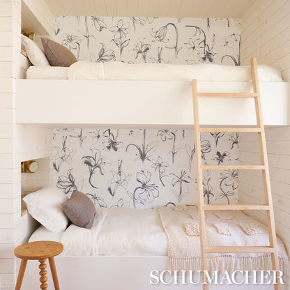 Slate gray floral wallpaper backdrop.