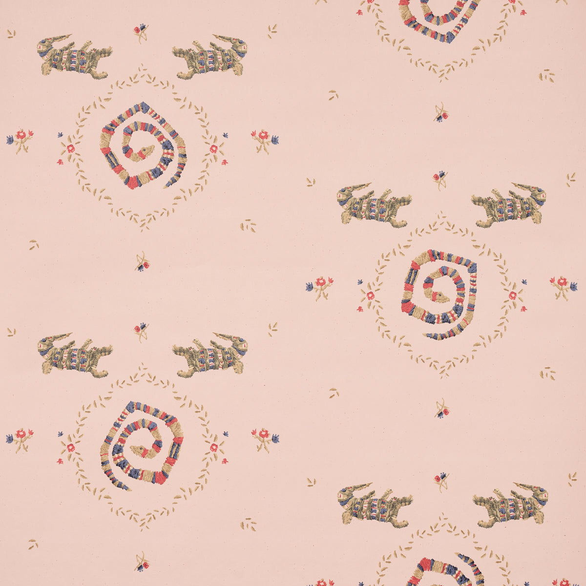 Muted pink backdrop fabric with reptile motifs and delicate borders.
