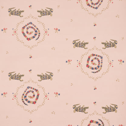 Muted pink backdrop fabric with reptile motifs and delicate borders.