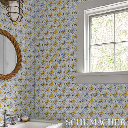 Rustic bathroom wallpaper with yellow & blue trellis pattern; rope-framed round mirror, chrome faucet sink, white window frame.
